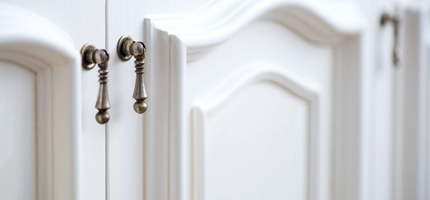 Detail of vintage white cabinet - selective focus, copy space