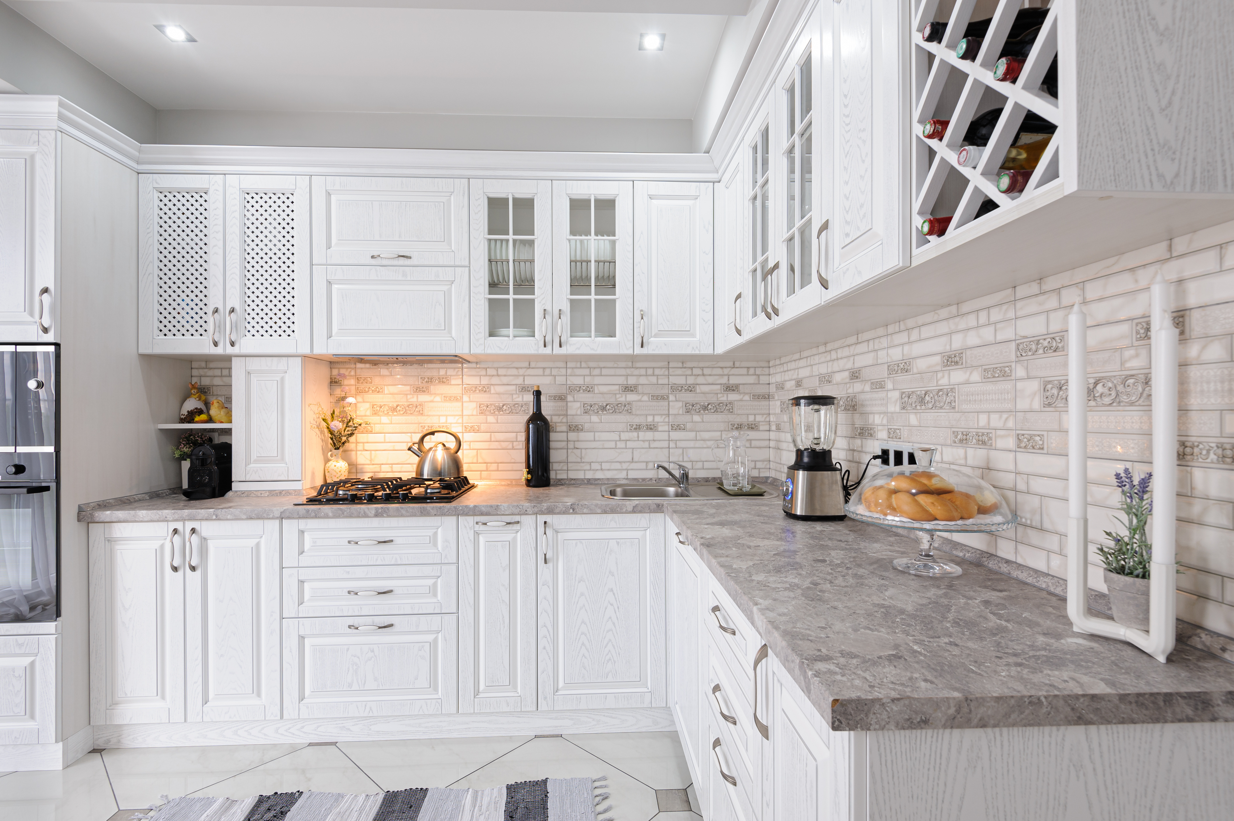 a kitchen with white cabinets