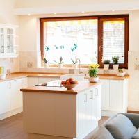 Modern white kitchen equipped with appliances