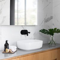 white ceramic sink with faucet