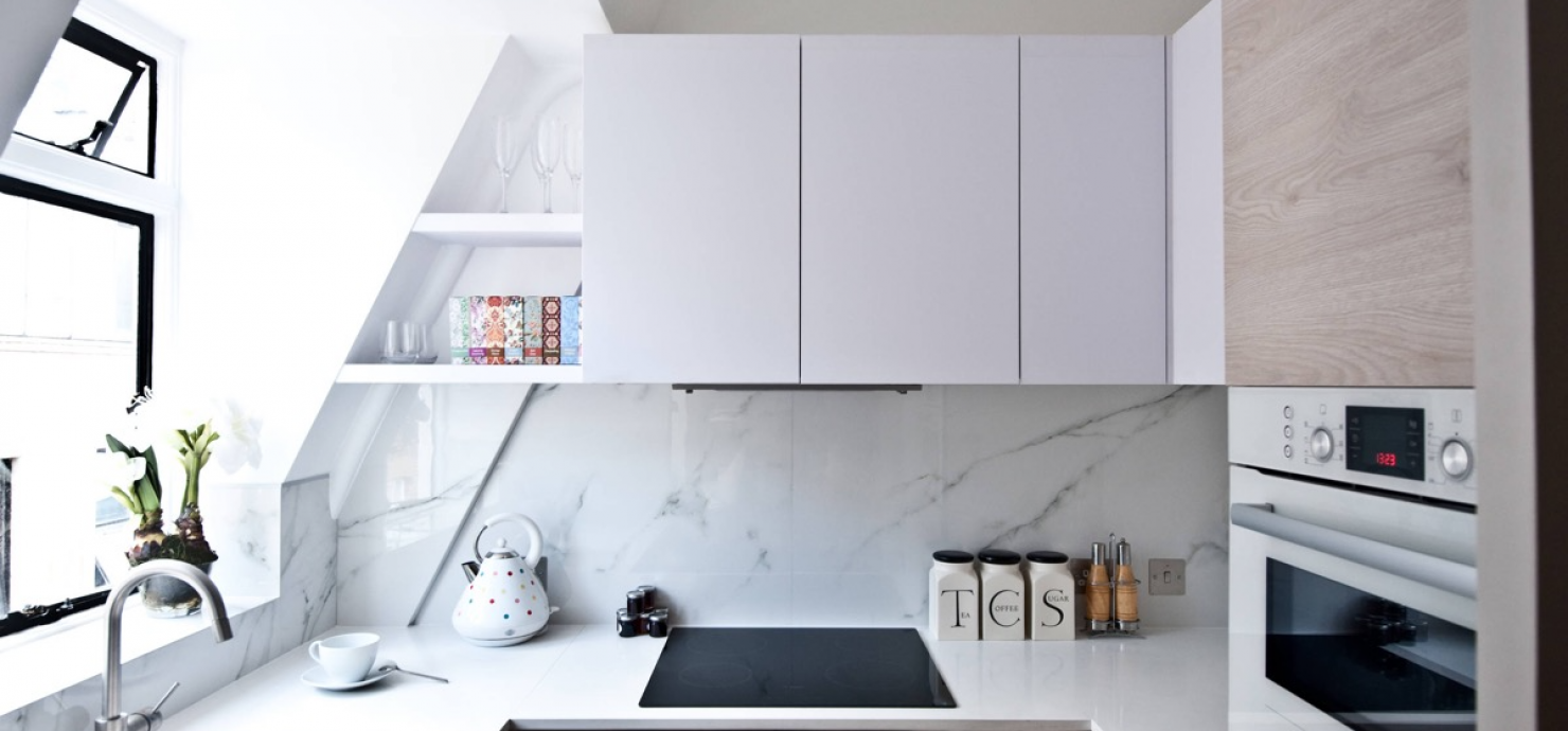 bright and airy kitchen showing what ikea cabinets might look like with with white upper cabinets and brown toned lower cabinets